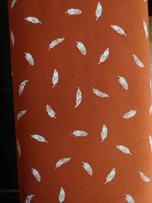 Rust cotton jersey with white flowers